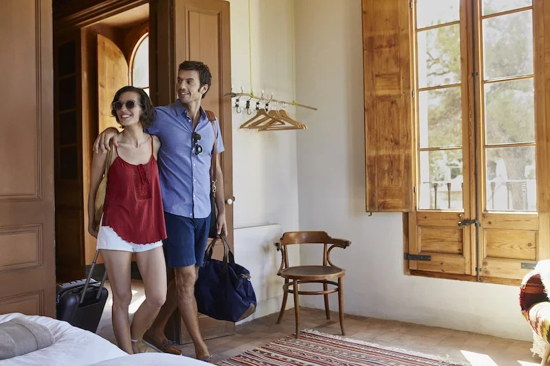 couple enters hotel room